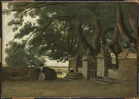 Paysage breton : une grille ombragée par de grands arbres.