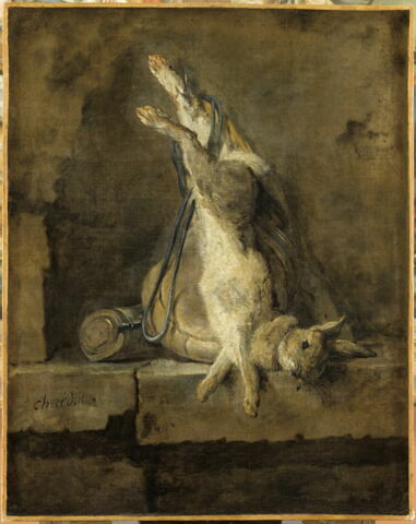 Lapin mort et attirail de chasse