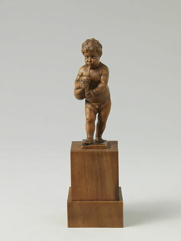 Statuette : Enfant jouant de la musette