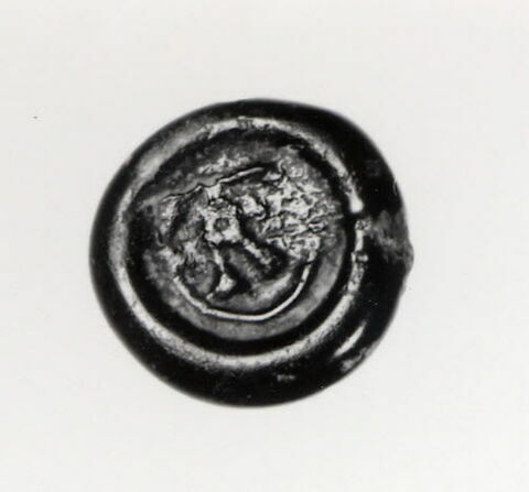 Disque orné d'un signe mystérieux, image 2/2