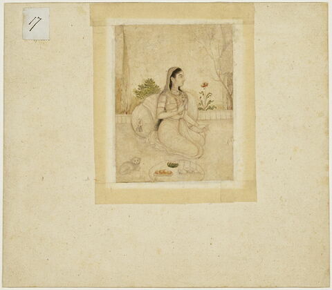Jeune femme agenouillée tenant un flacon et une coupe, image 2/3