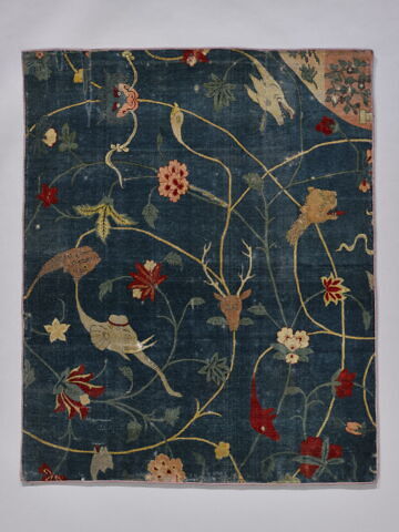 Quatre fragments de tapis à décor de grotesques ou waq-waq