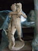 Jeune faune portant un chevreau, image 1/2